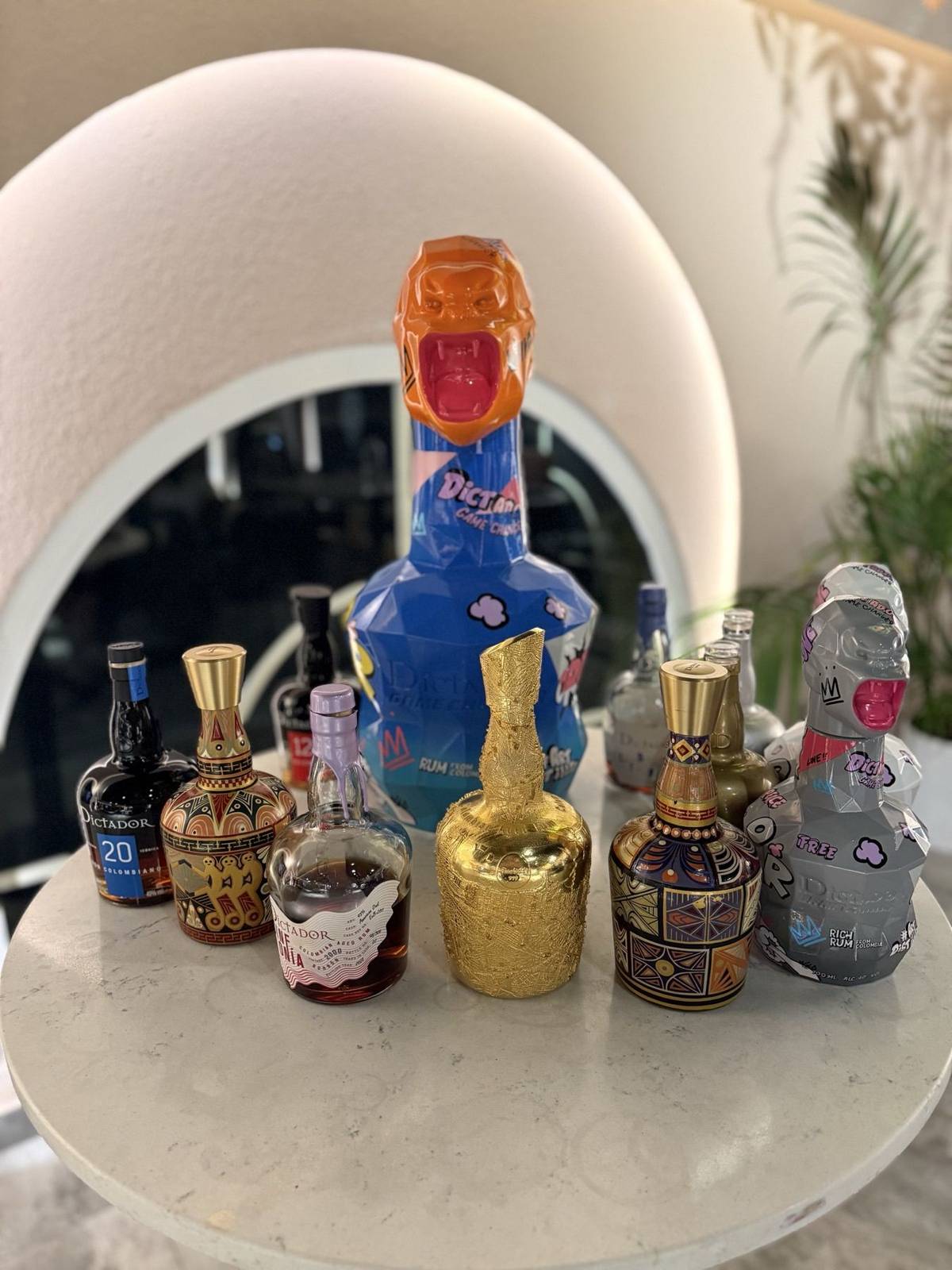 Rare Dictador rum bottles displayed on a table at Five Iron Golf UAE